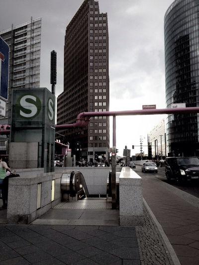 City street against cloudy sky