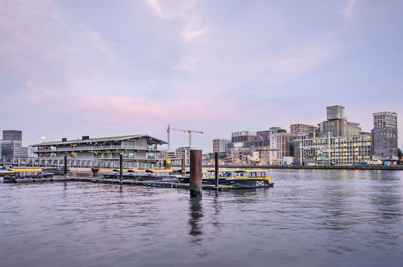 Floating office, watertaxis and harbour in rotterdam