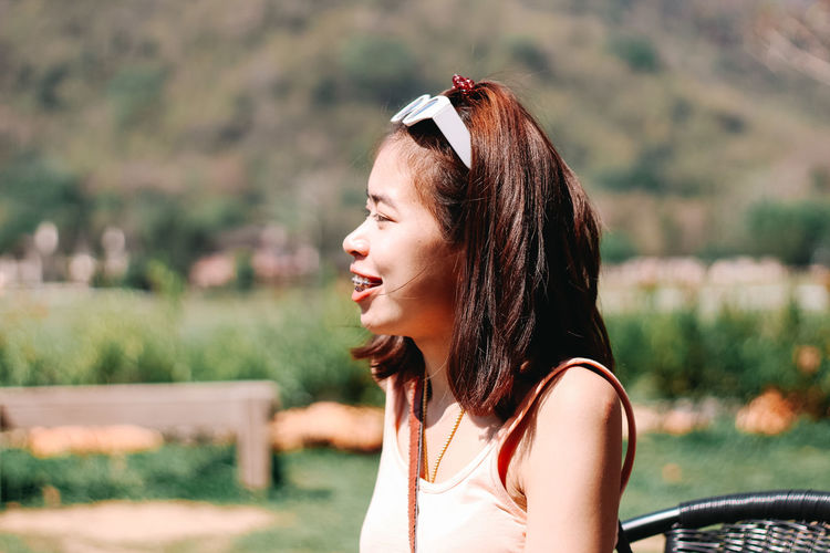 Side view of a young woman looking away