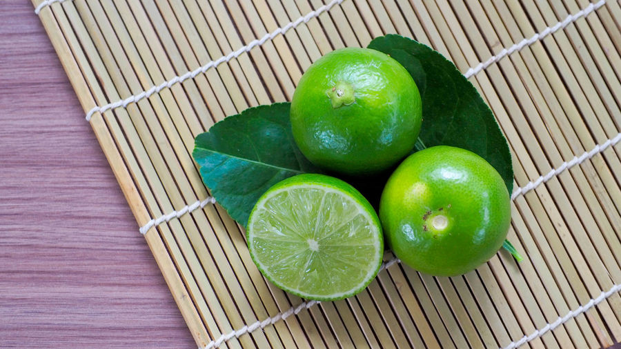 High angle view of green fruits in basket
