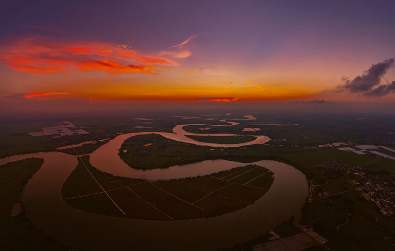 Aerial view of city during sunset