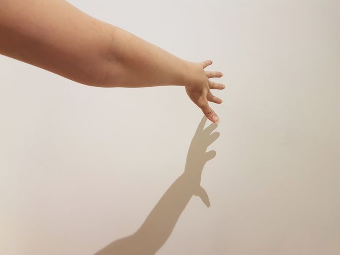 Woman's hand against white background
