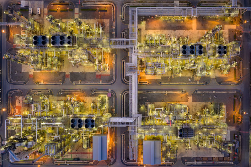Oil refinery and gas petrochemical industry with storage tanks steel pipeline area at twilight 