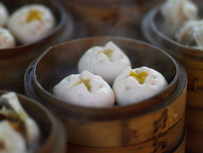 Close up of steaming custard dumplings in china