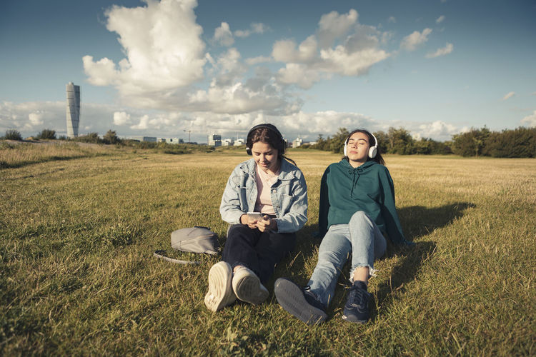 Young couple sitting on land