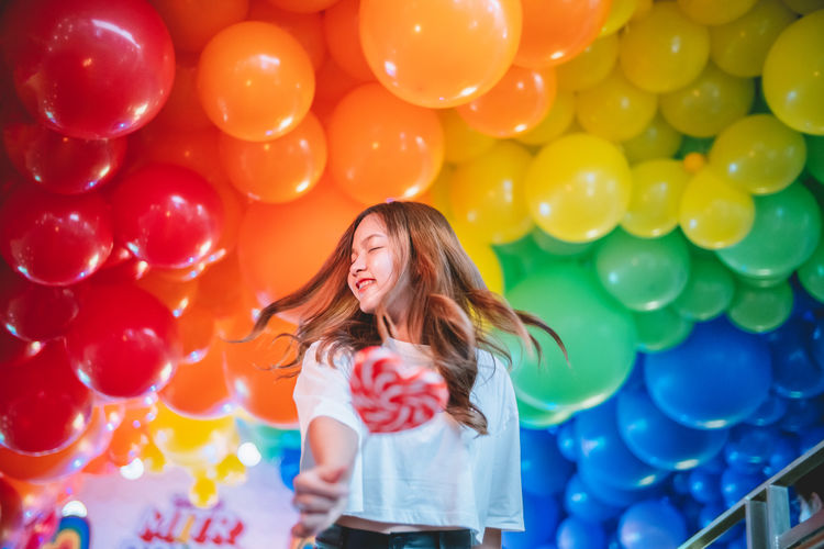 Young woman with balloons