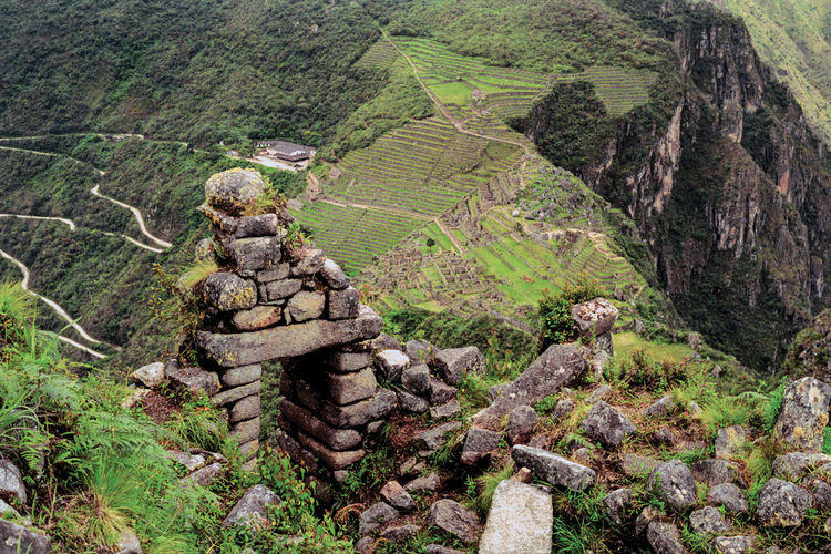 Stone walls ruins and agricultural terraces in the ancient inca city of machu picchu, in peru.