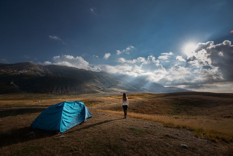 Scenic view of tent on field against sky, campo imperatore