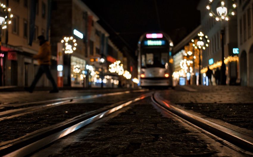 Illuminated tramway station platform at night