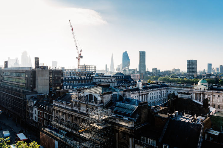 Cityscape of the city of london. high angle view a sunny day in the morning with sun flare