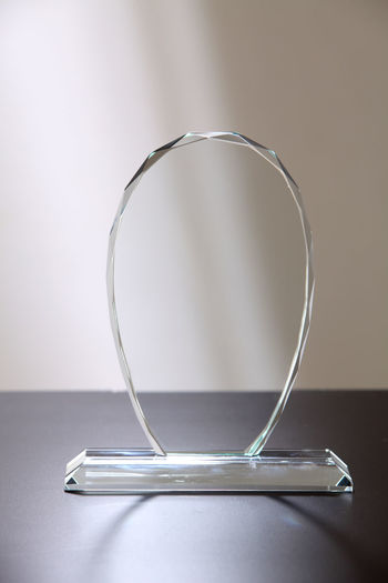 Close-up of glass award on table