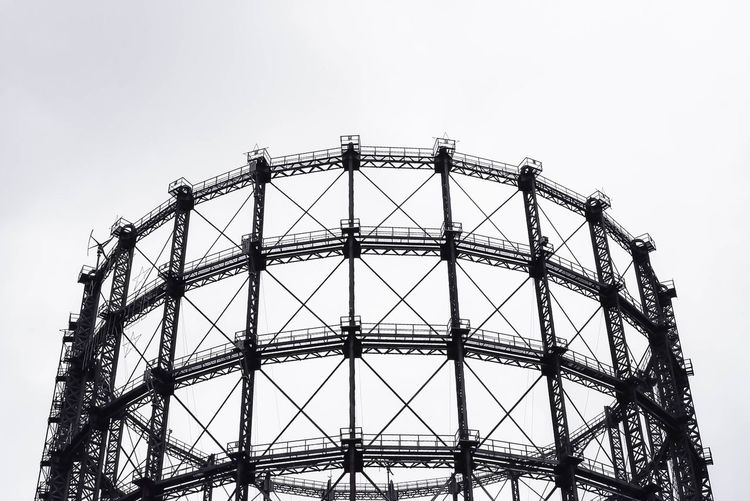 Low angle view of schoneberg gasometer against clear sky
