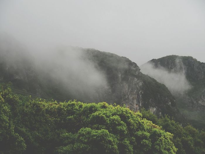 Scenic view of mountains during foggy weather