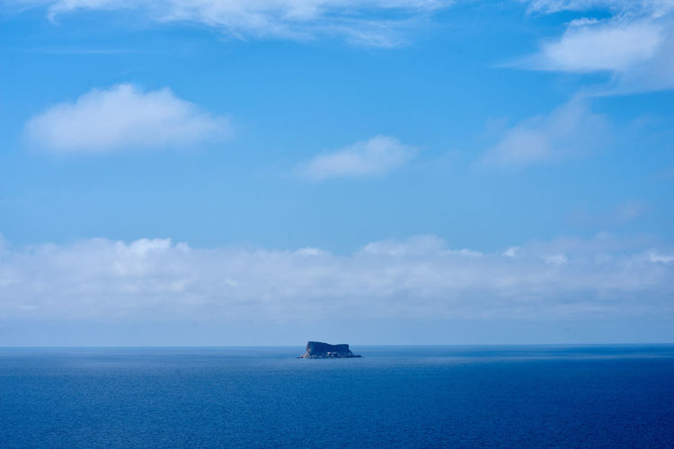 Scenic view of blue sea against sky