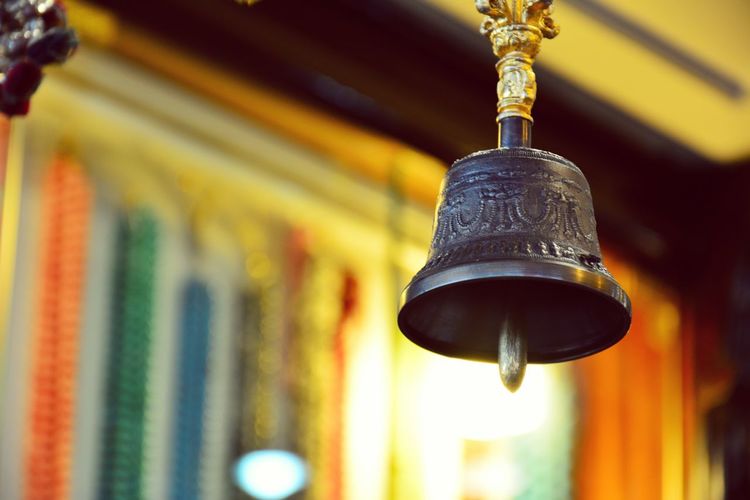 Low angle view of bell hanging in temple