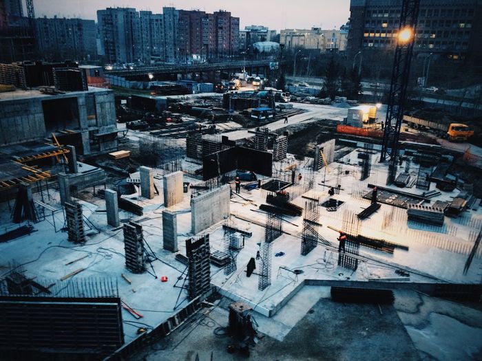 High angle view of construction site in city at dusk