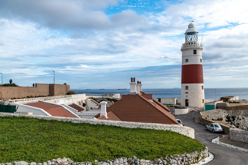 Europa point lighthouse by sea against sky