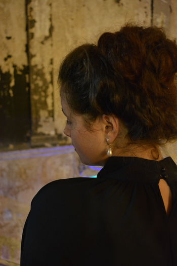 Rear view of woman with eyes closed