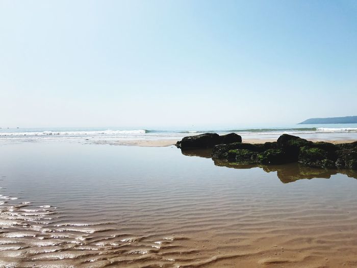 Scenic view of sea against clear sky