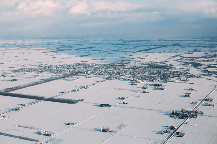 Aerial view of city against sky