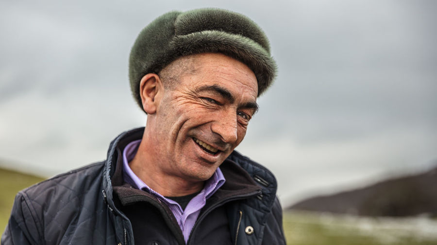 Smiling azerbaijani man with a hat