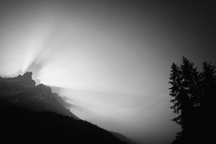 Scenic view of silhouette mountains against clear sky