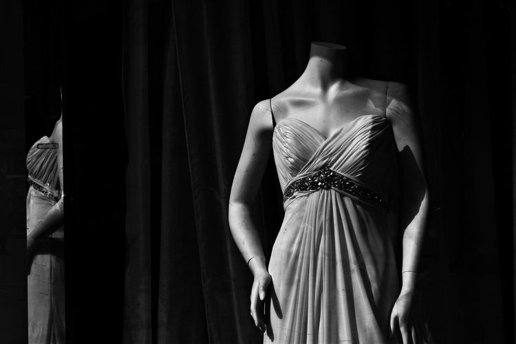 Rear view of woman standing in store