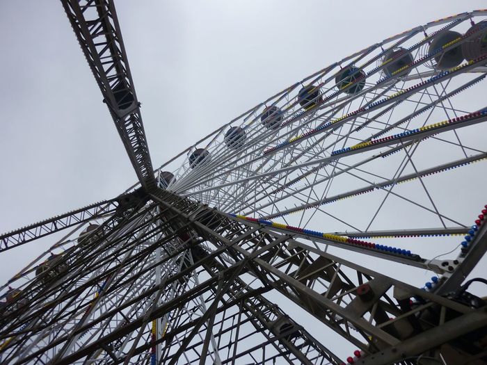 Low angle view of ferris wheel against the sky