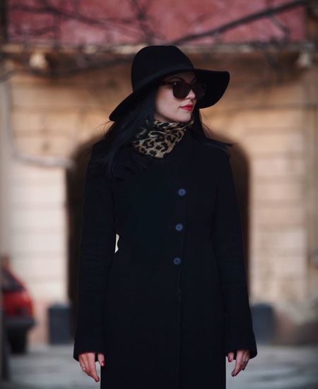Portrait of young woman standing outdoors