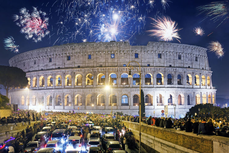 Fireworks over coliseum at night