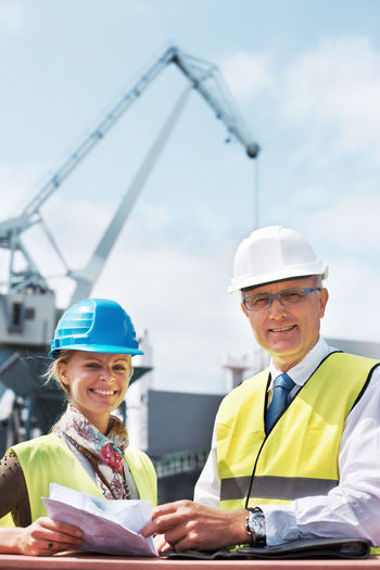 Portrait of engineers standing at site