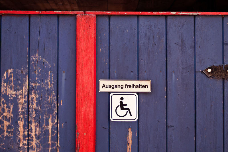 Disabled sign on wooden door