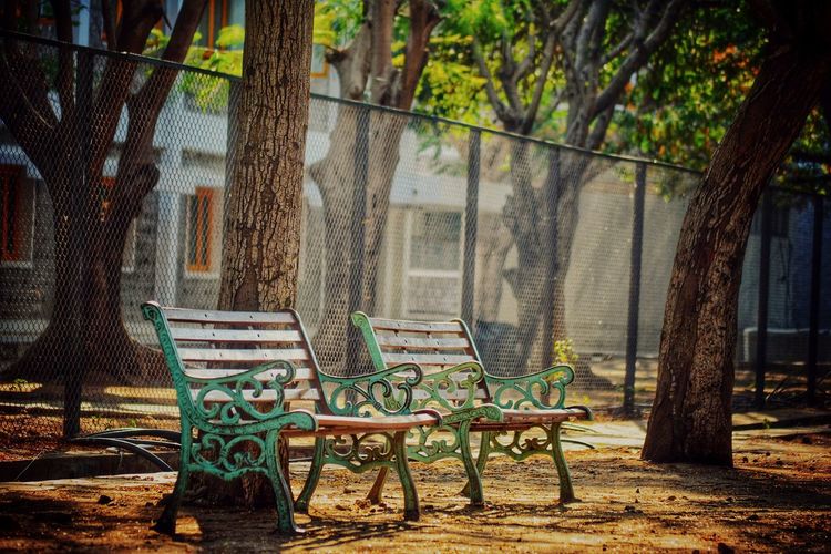 Empty chairs and tables in park