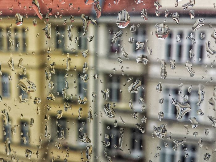 Full frame shot of window with raindrops 