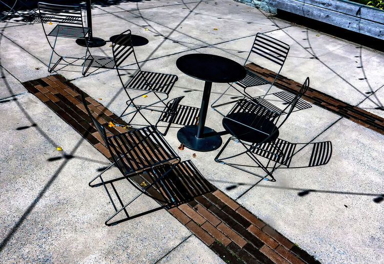 Shadows and shapes on the ground of a patio