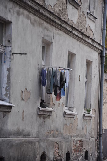 Clothesline hanging on window in old building