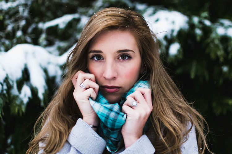 Portrait of confident young woman during winter