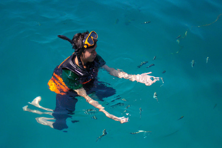 Man swimming in sea