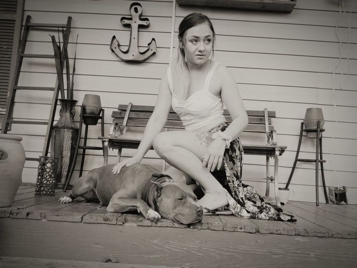 Woman touching dog outdoors
