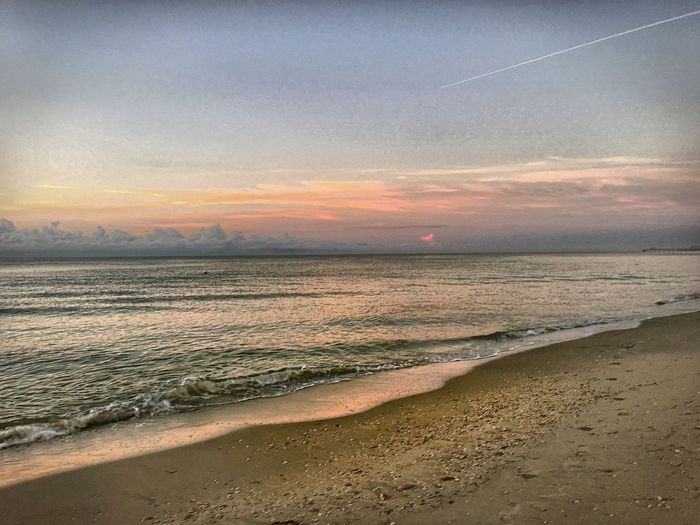 Scenic view of sea against sky during sunset