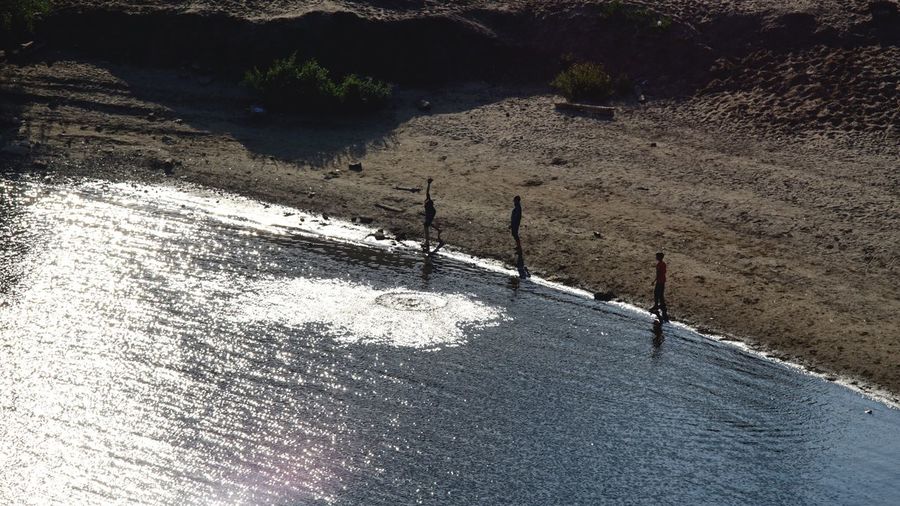 High angle view of shadow on shore at beach