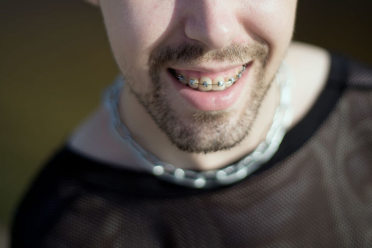 Close-up portrait of a smiling young man