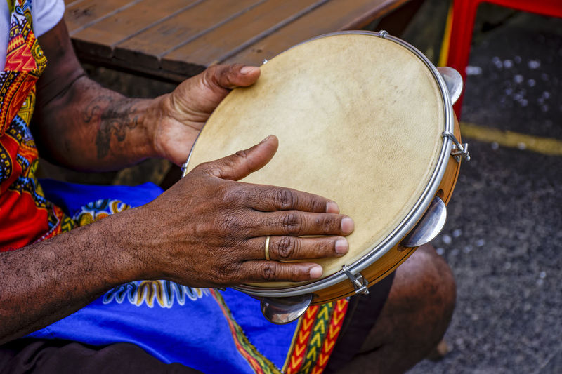 Percussionist playing tambourine in the famous streets of pelourinho district in city of salvador