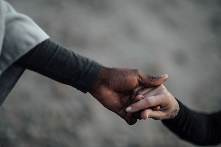 Close-up of man holding hands