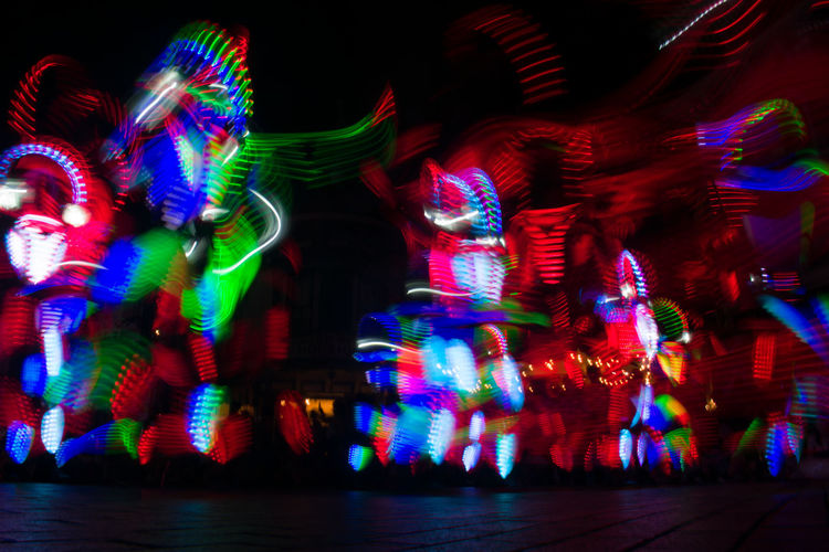 Illuminated carousel in amusement park