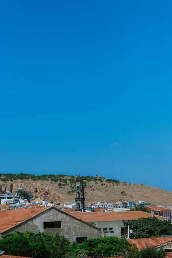 High angle view of townscape against clear blue sky