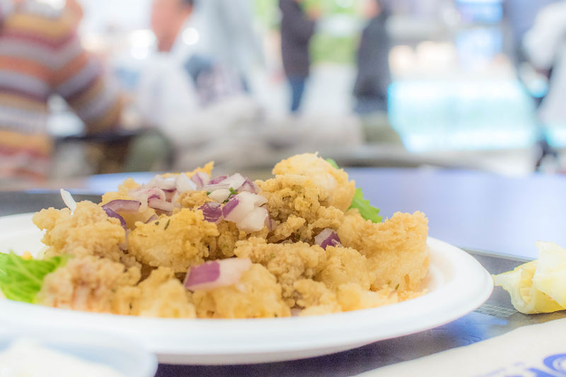 Close-up of deep fried calamari served in plate.