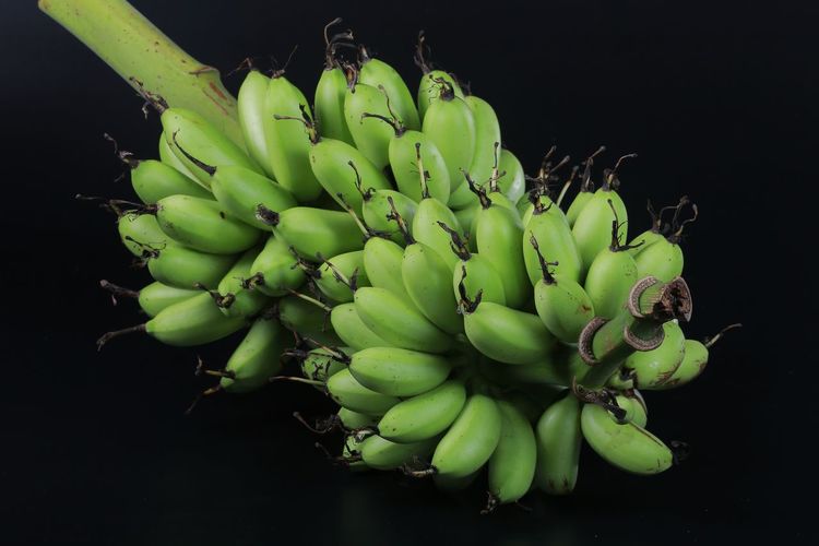 Close-up of banana against black background