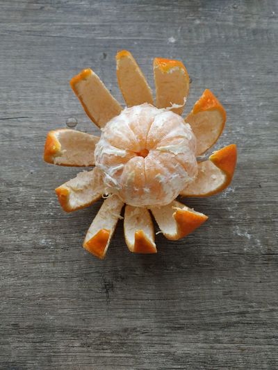 High angle view of orange flowers on table