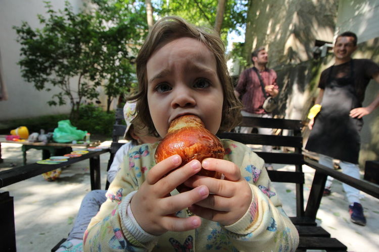 Child eating brioche bread